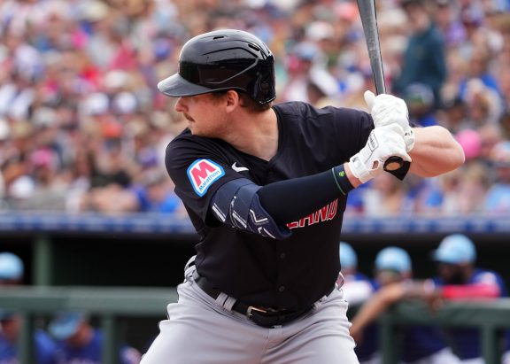 Kyle Manzardo swings a baseball bat