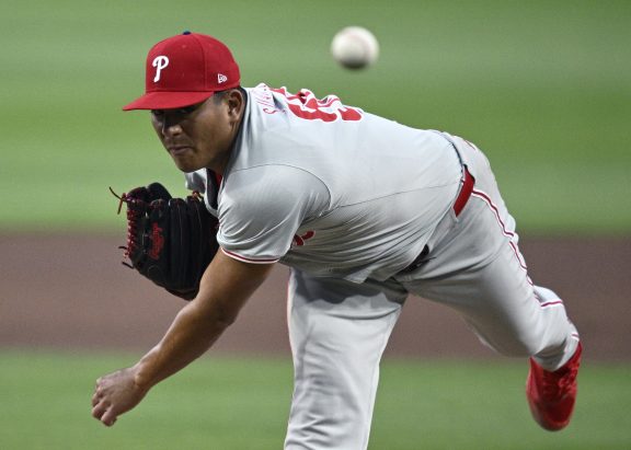 Ranger Suárez throws a baseball in someone's direction.